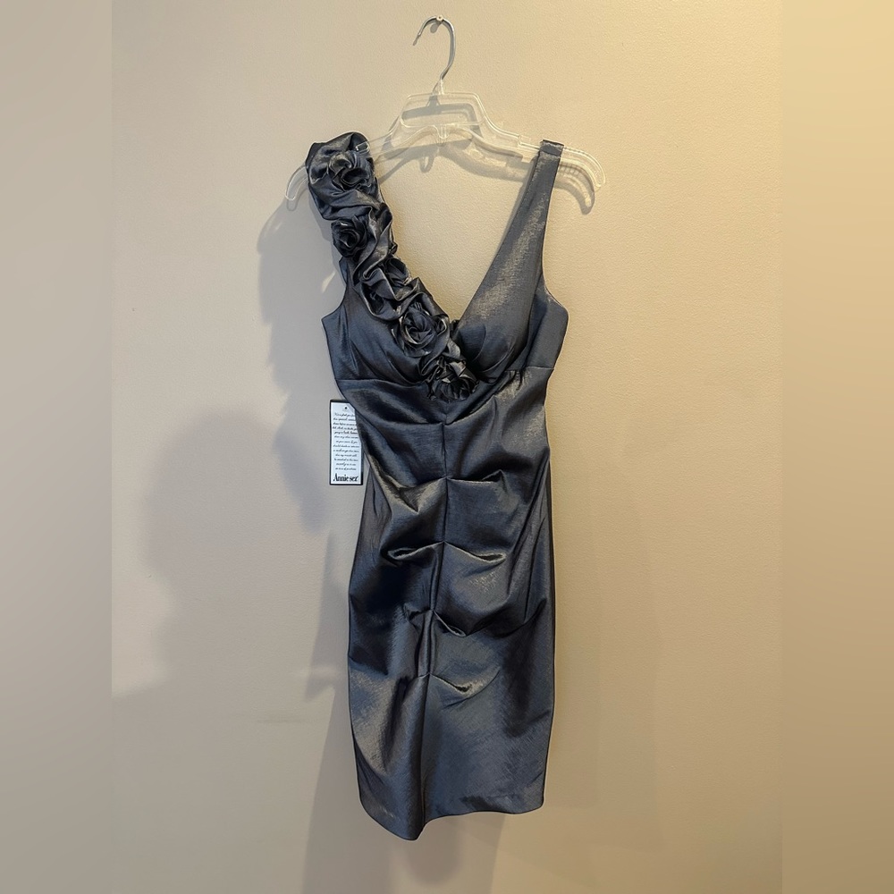 XSCAPE by Joanna Chen midi deep silver dress with chest ruffles.